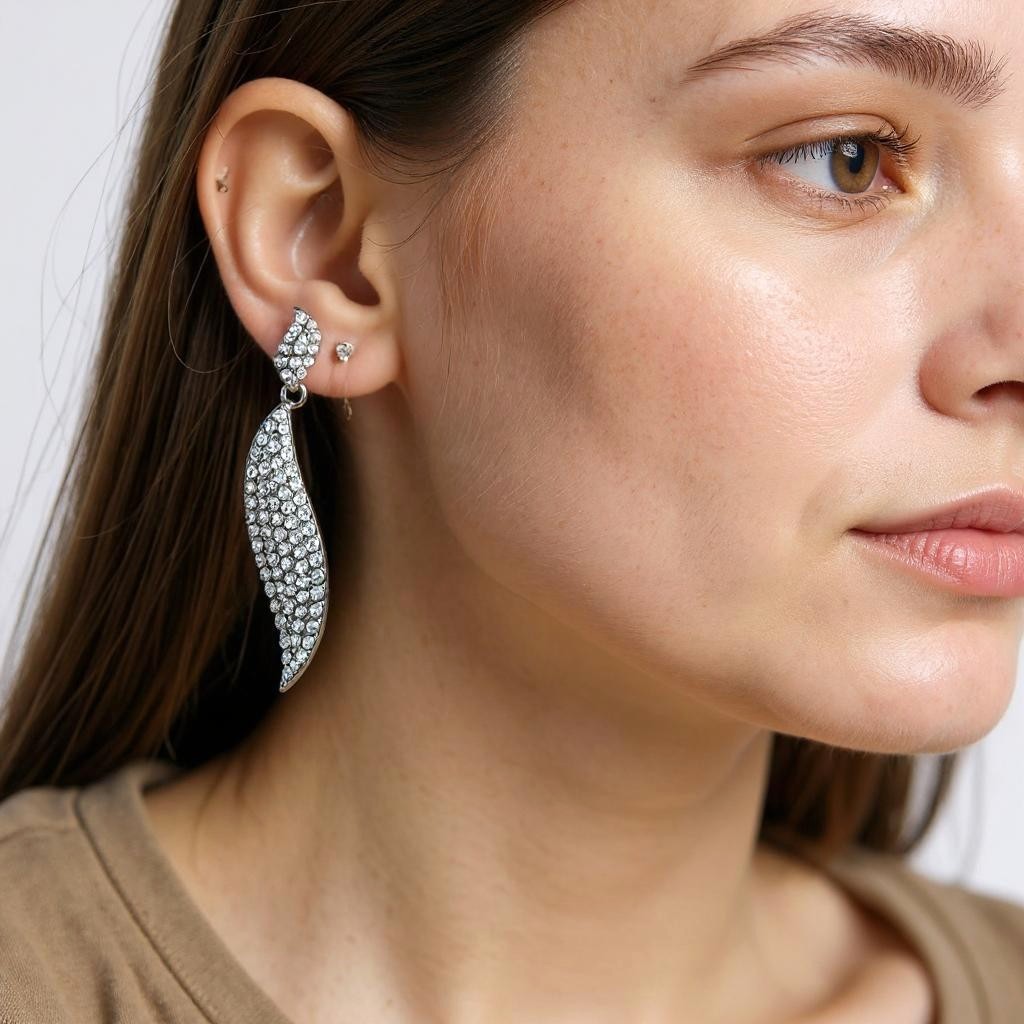Reet & Riwaz's Shimmery Flame Silver Drop Earrings, zirconia Silver Plated Drops & Danglers for beautiful ladies.