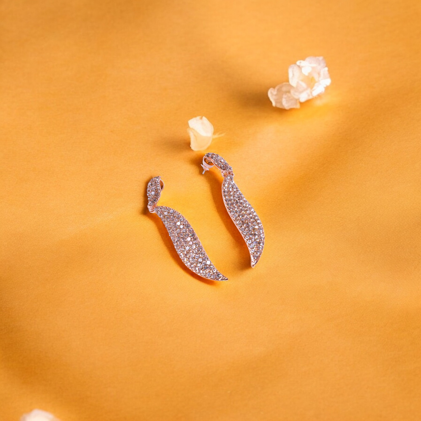 Reet & Riwaz's Shimmery Flame Rose Gold Drop Earrings, zirconia Rose Gold Plated Drops & Danglers for beautiful ladies.
