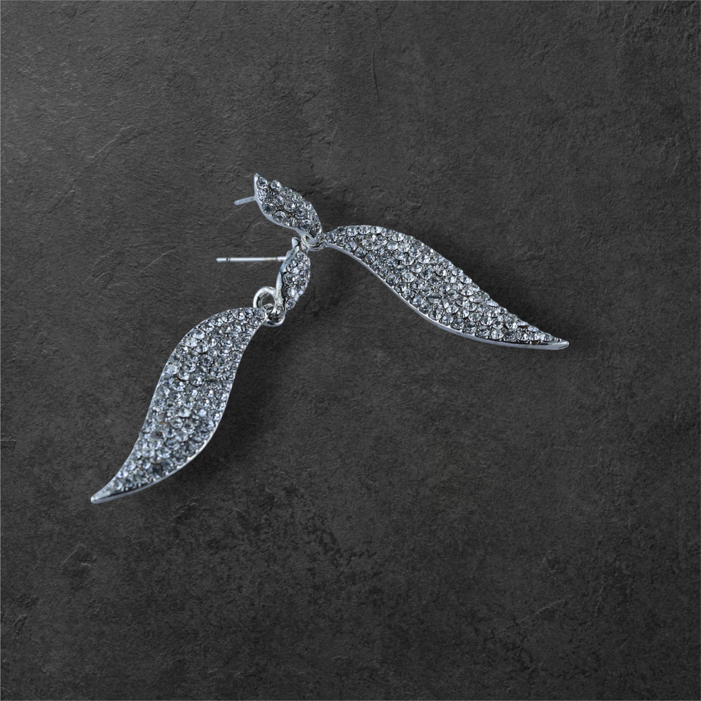 Reet & Riwaz's Shimmery Flame Silver Drop Earrings, zirconia Silver Plated Drops & Danglers for beautiful ladies.