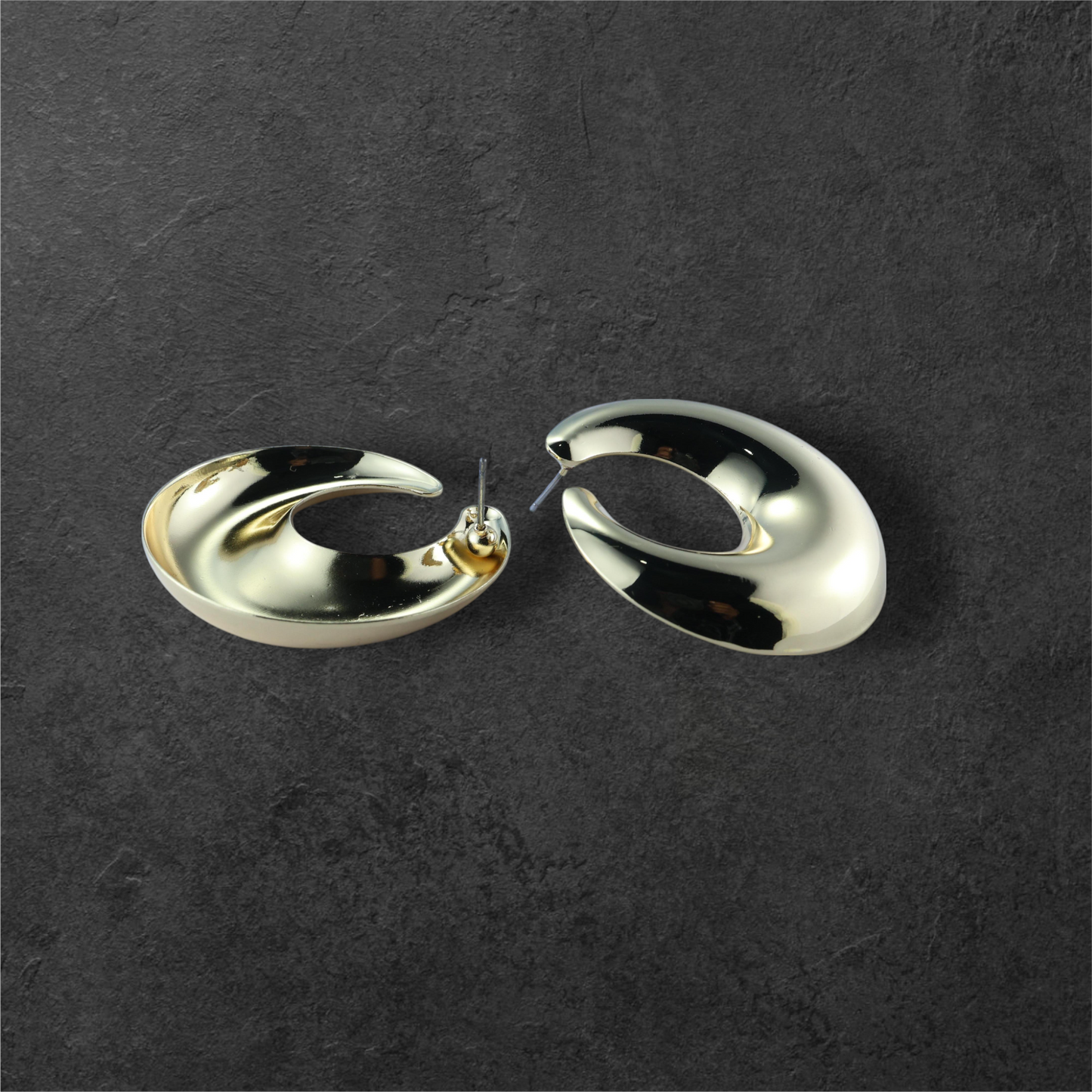 Reet & Riwaz's Anti-tarnish Gold Plated Hoop earrings. Crafted with meticulous attention to detail, these stunning hoop earrings feature a sleek, curved design that exudes sophistication and modern luxury.