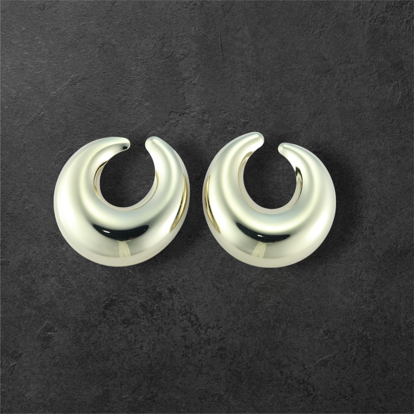 Reet & Riwaz's Anti-tarnish Gold Plated Hoop earrings. Crafted with meticulous attention to detail, these stunning hoop earrings feature a sleek, curved design that exudes sophistication and modern luxury.